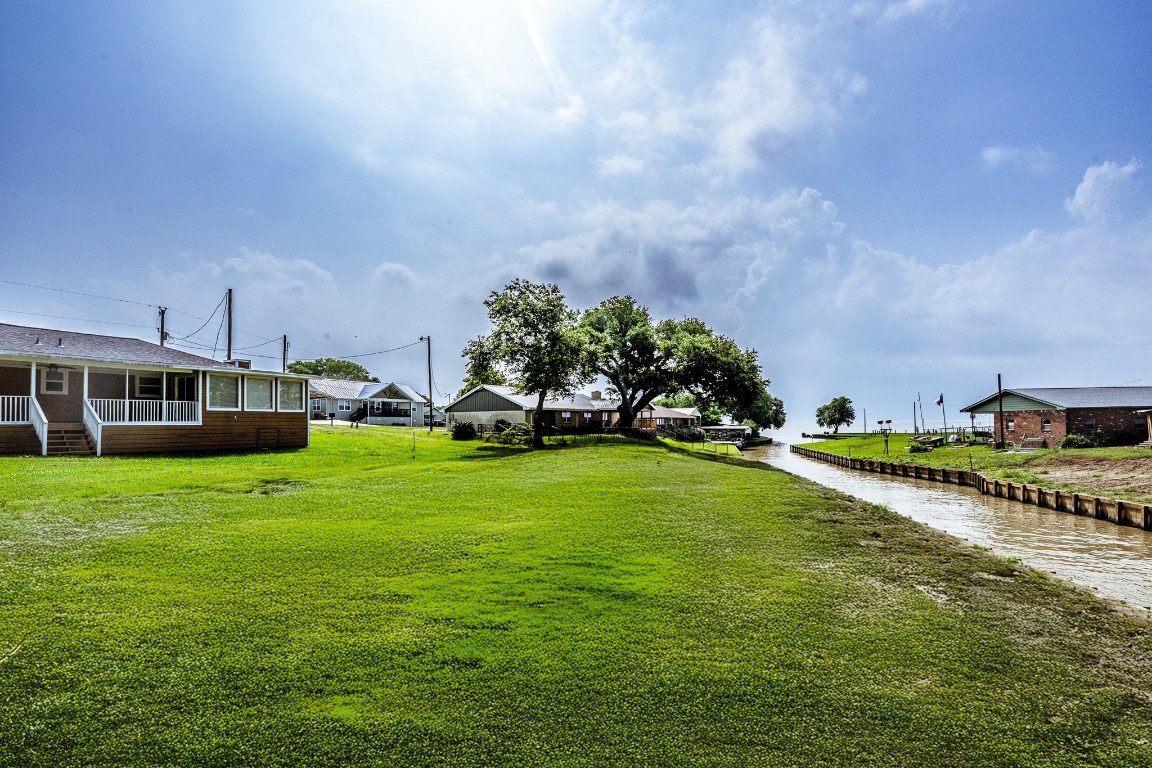 280 Crestmont Point Blank, TX 77364 - Photo 24 of 25 a view of a house with a big yard and potted plants