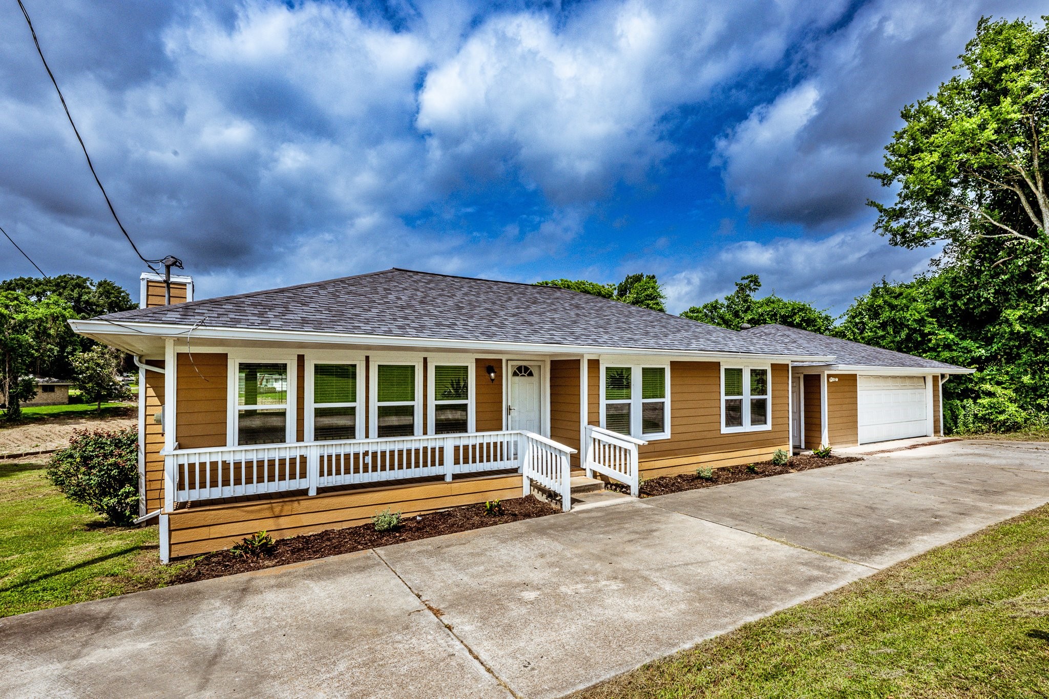 280 Crestmont Point Blank, TX 77364 - Photo 25 of 25 a view of a house with a backyard and a yard