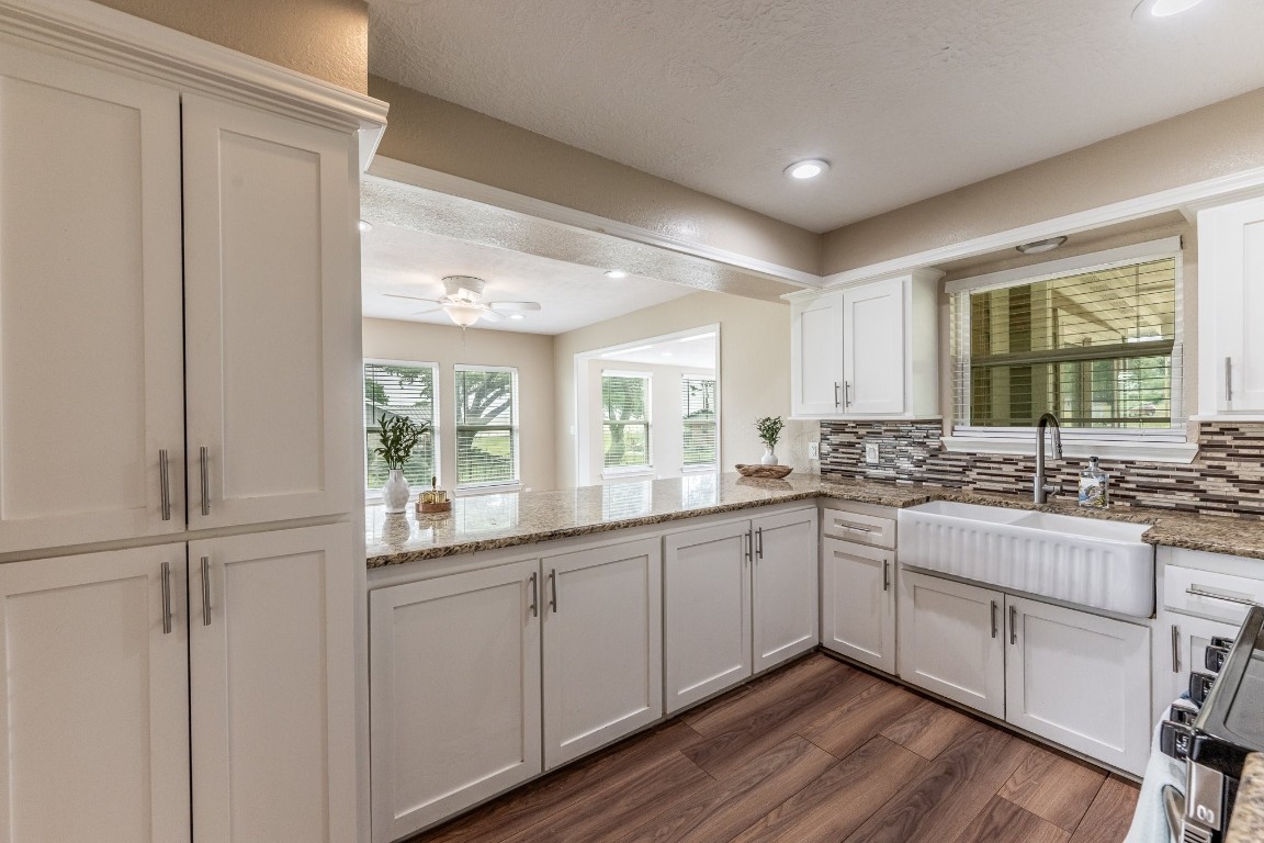 280 Crestmont Point Blank, TX 77364 - Photo 6 of 25 a large white kitchen with a sink and cabinets