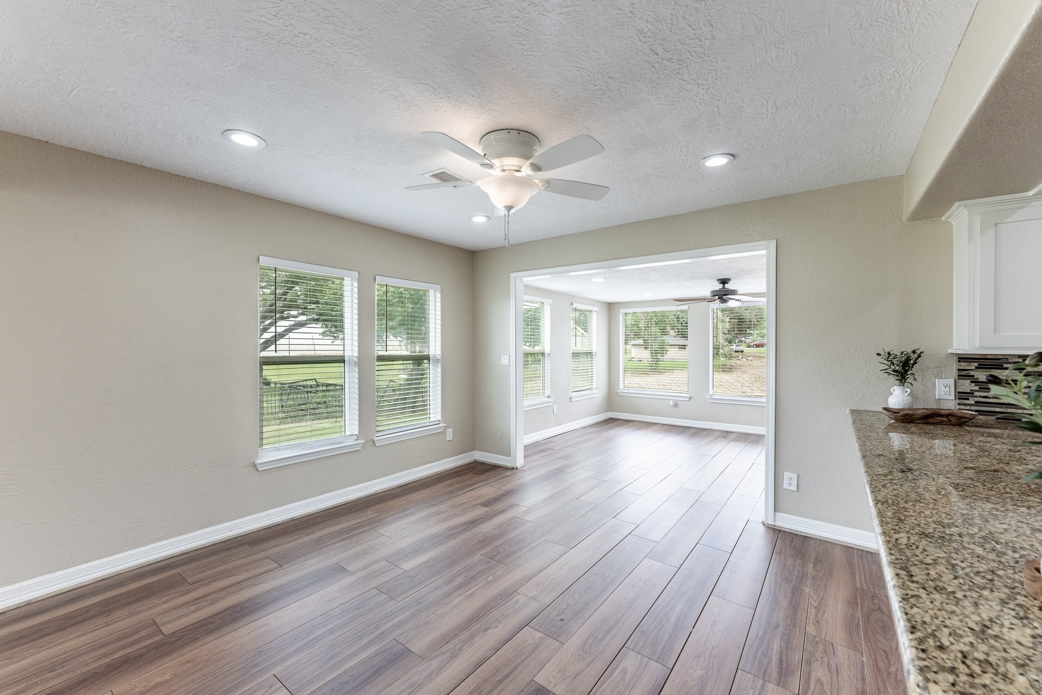 280 Crestmont Point Blank, TX 77364 - Photo 8 of 25 a view of an empty room with a window and wooden floor