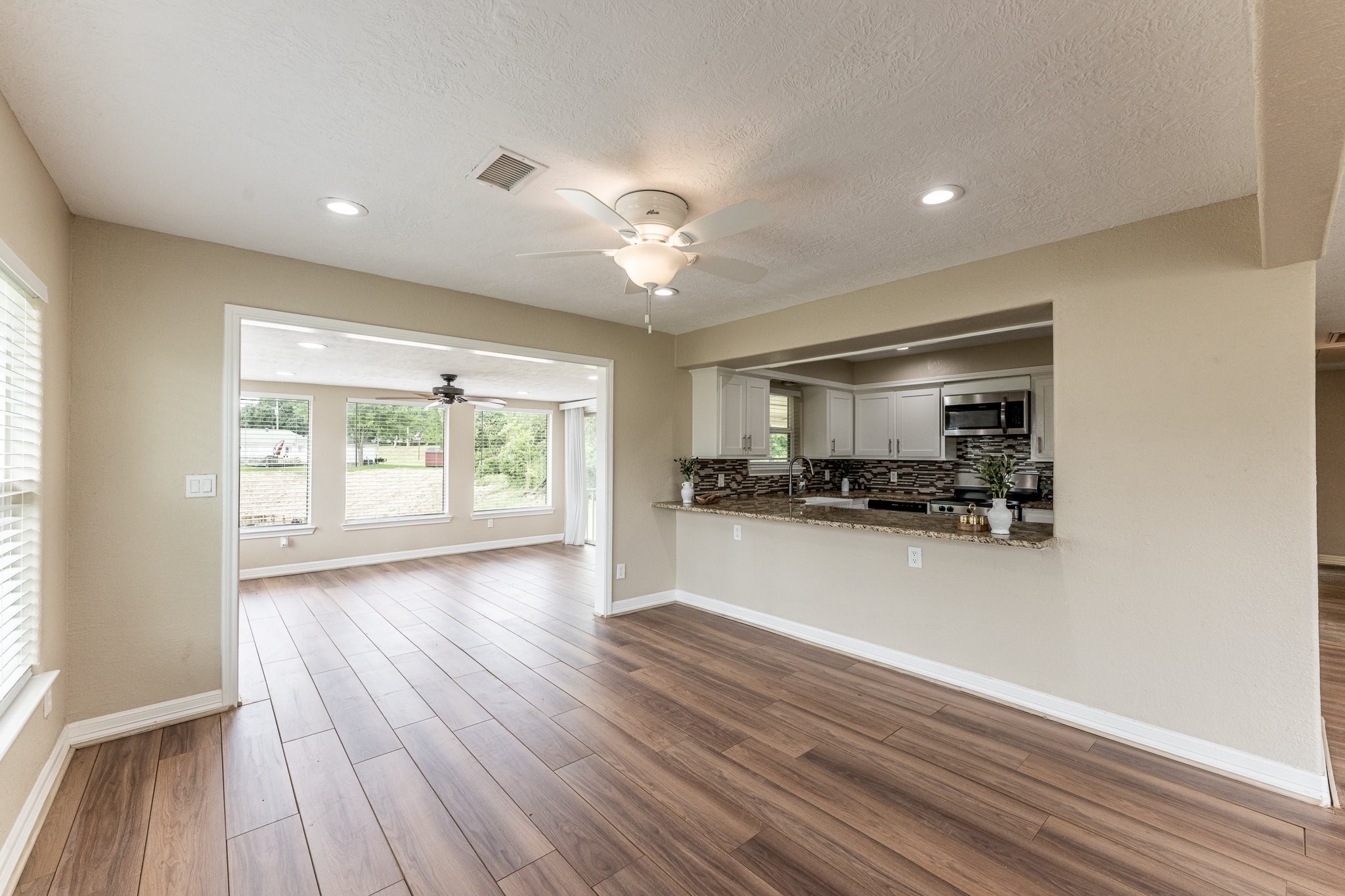 280 Crestmont Point Blank, TX 77364 - Photo 9 of 25 a view of empty room with wooden floor and window