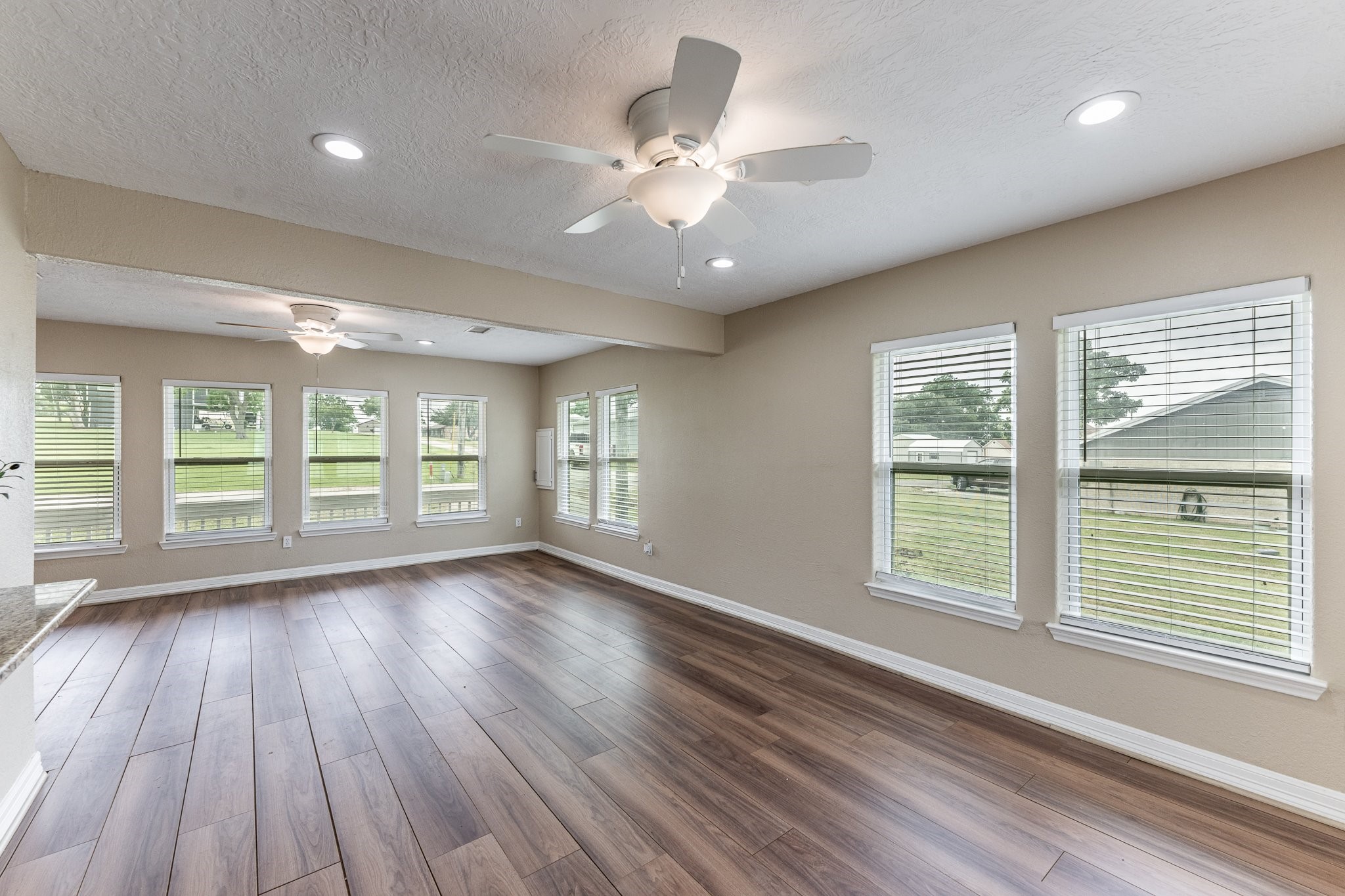 280 Crestmont Point Blank, TX 77364 - Photo 10 of 25 a view of an empty room with wooden floor and a window