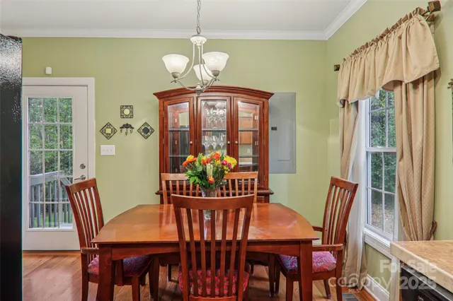 a kitchen with granite countertop a refrigerator stove and microwave