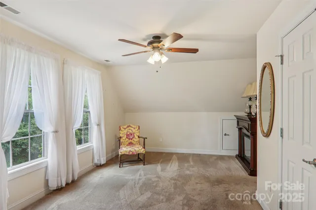 a view of a chair and table in backyard