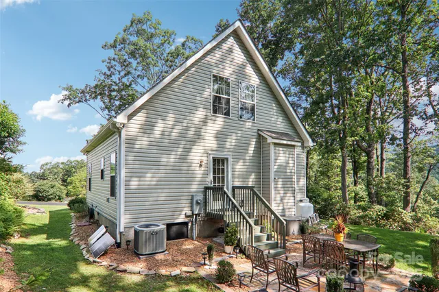 a view of backyard with patio and outdoor seating