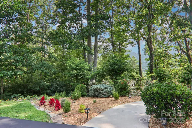 a wooden fence with trees in the background