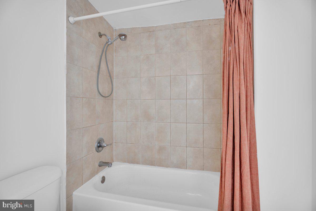 3151 Richmond Street, Unit 3 Philadelphia, PA 19134 - Photo 20 of 22 a bathroom with a bath tub and a shower