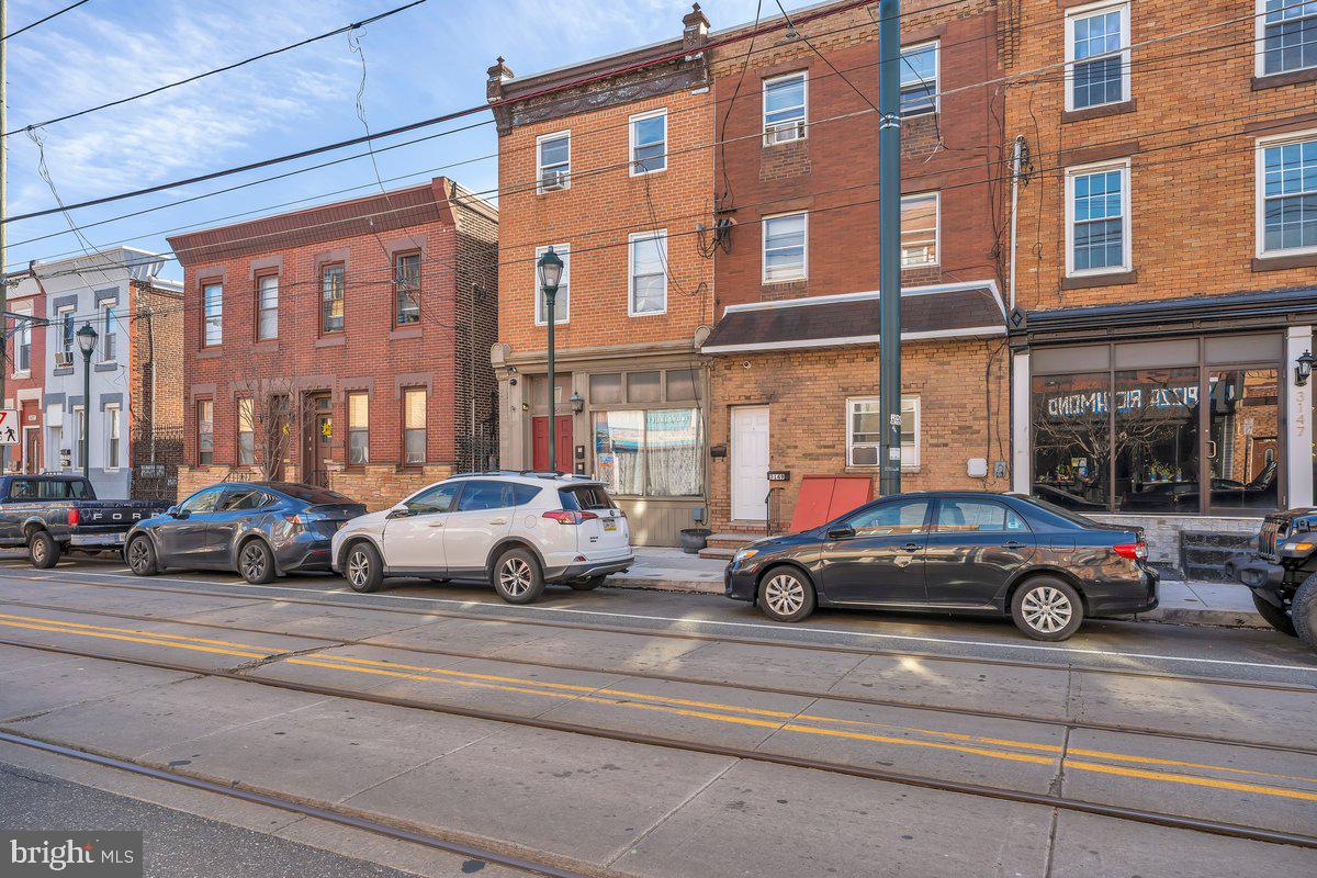 3151 Richmond Street, Unit 3 Philadelphia, PA 19134 - Photo 3 of 22 a view of cars parked in front of a building