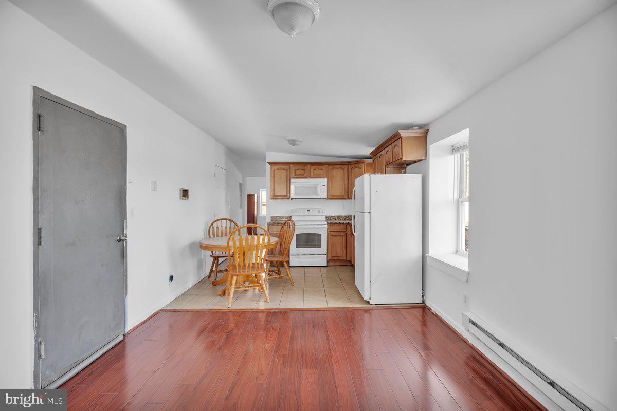 3151 Richmond Street, Unit 3 Philadelphia, PA 19134 - Photo 5 of 22 a view of kitchen with furniture and wooden floor