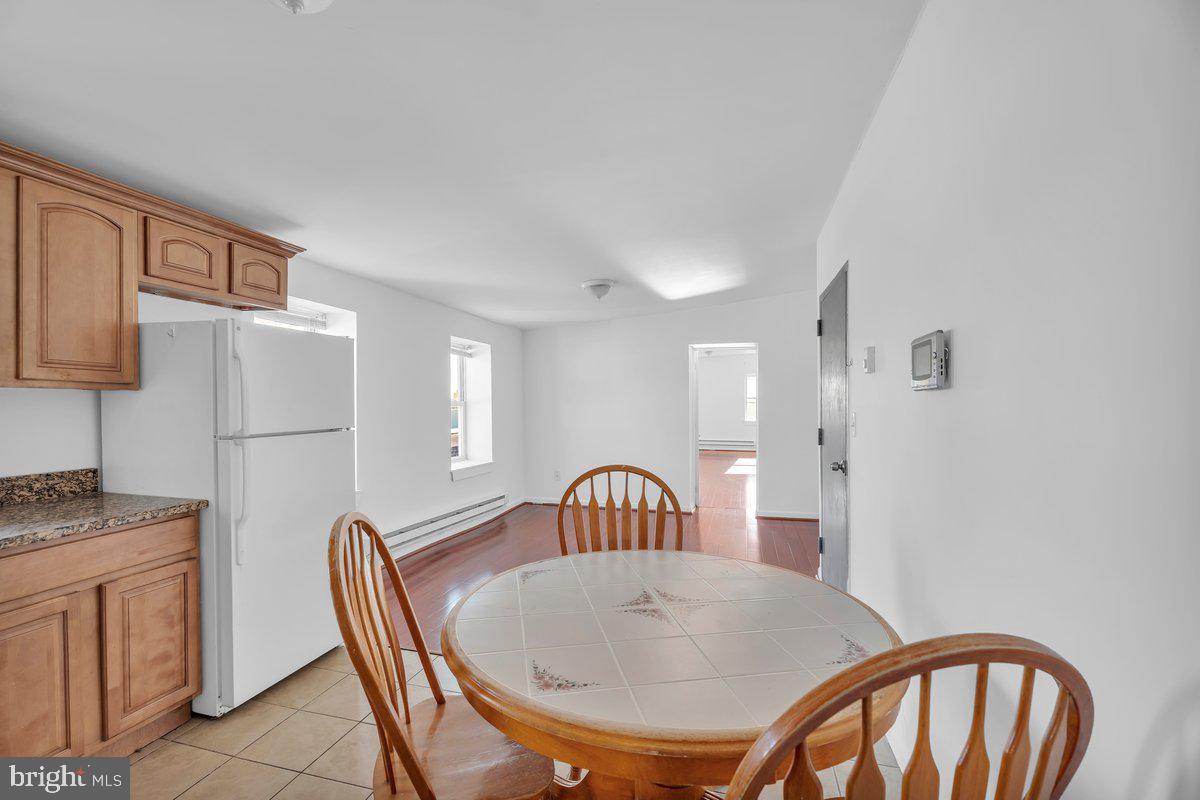 3151 Richmond Street, Unit 3 Philadelphia, PA 19134 - Photo 9 of 22 a view of a a dining room with furniture window and wooden floor