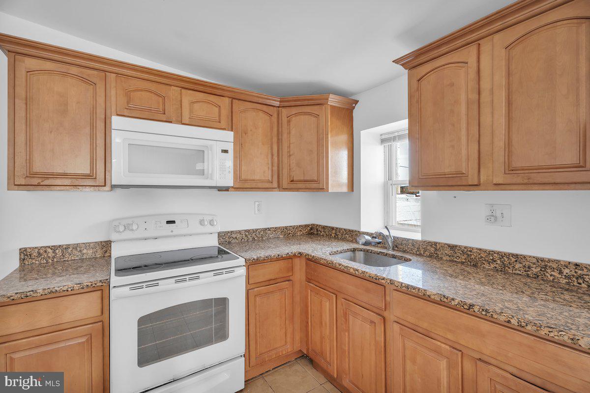 3151 Richmond Street, Unit 3 Philadelphia, PA 19134 - Photo 10 of 22 a kitchen with appliances cabinets and a counter top space