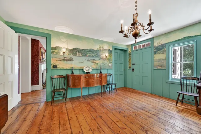 a view of a room with furniture wooden floor and window