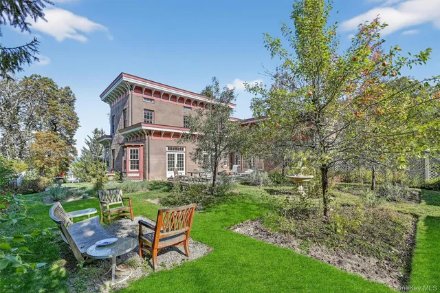 a view of a chairs in a backyard