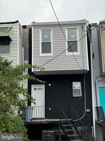a front view of a house with balcony