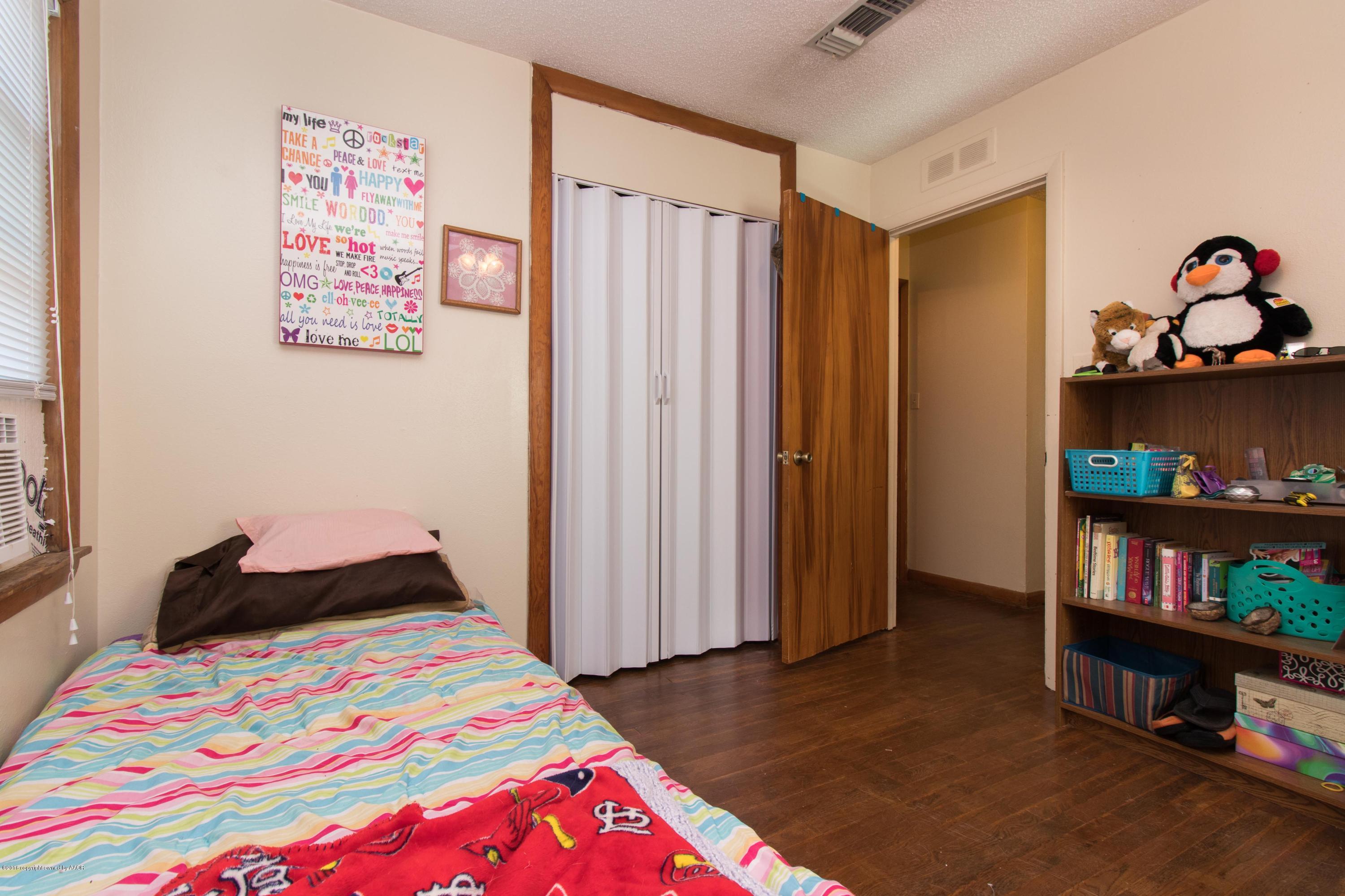 4309 South Monroe Street Amarillo, TX 79110 - Photo 13 of 16 a bedroom with a bed and a closet