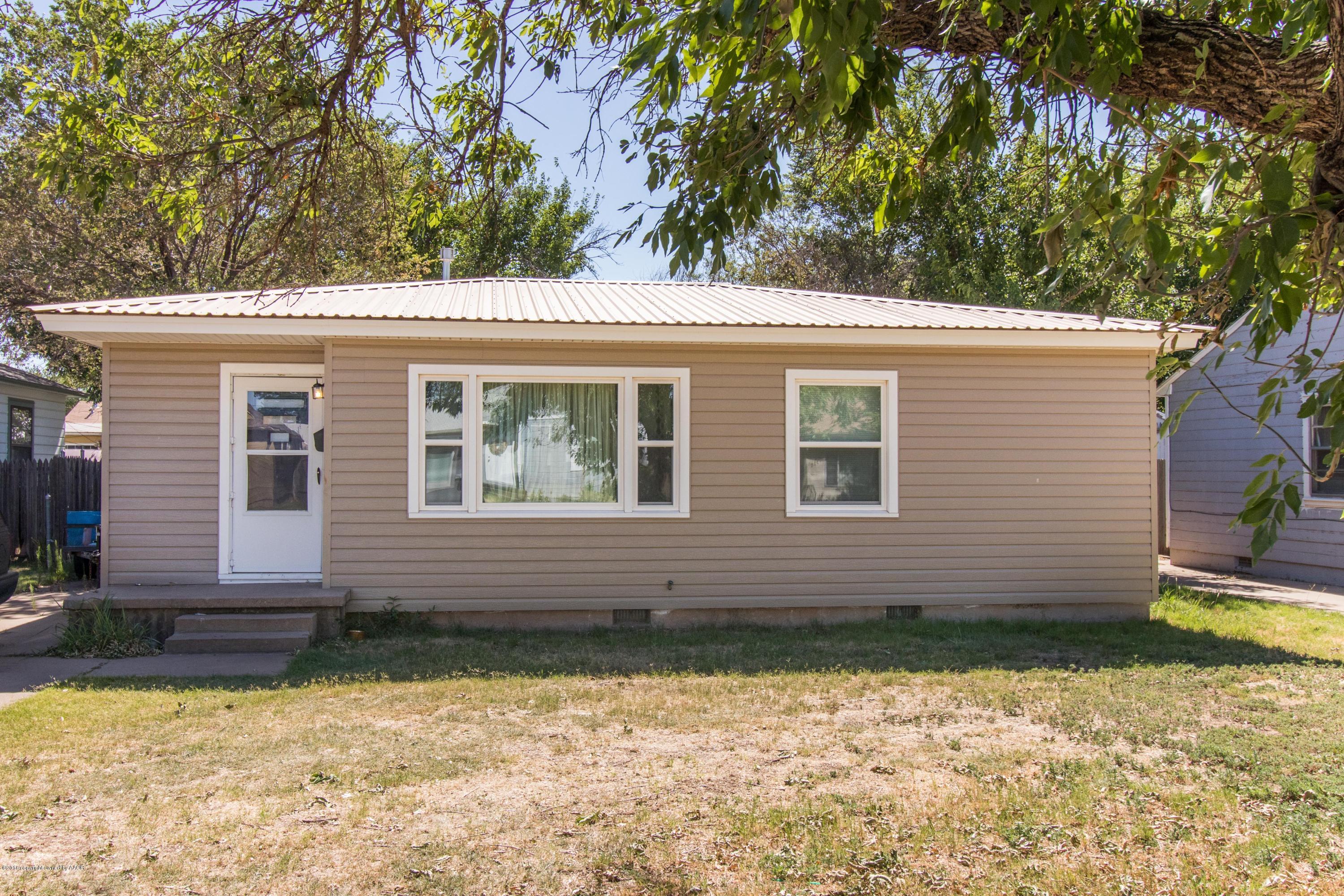 4309 South Monroe Street Amarillo, TX 79110 - Photo 2 of 16 a view of a house with a yard