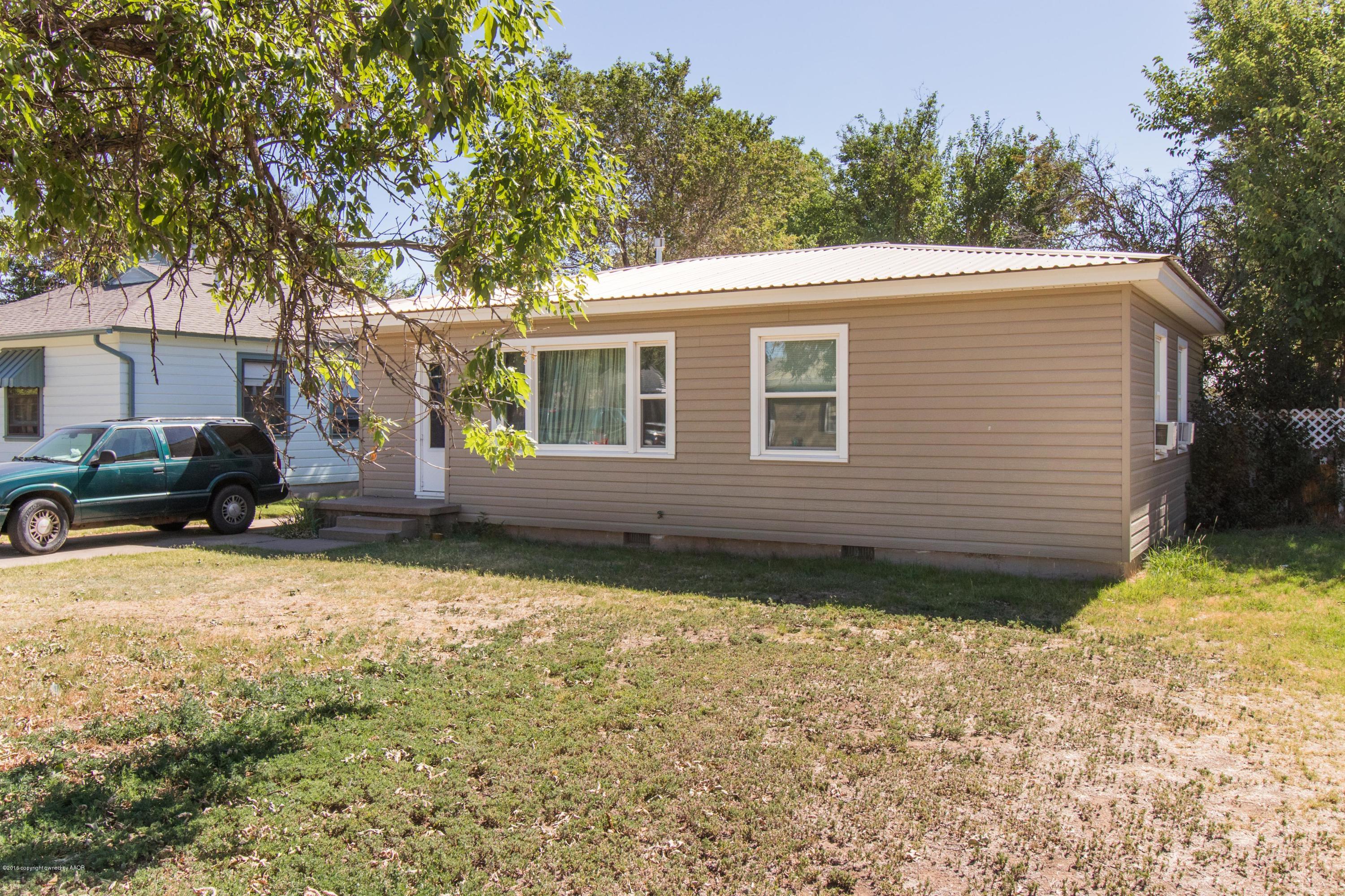 4309 South Monroe Street Amarillo, TX 79110 - Photo 3 of 16 a view of a house with a yard covered with snow in the background