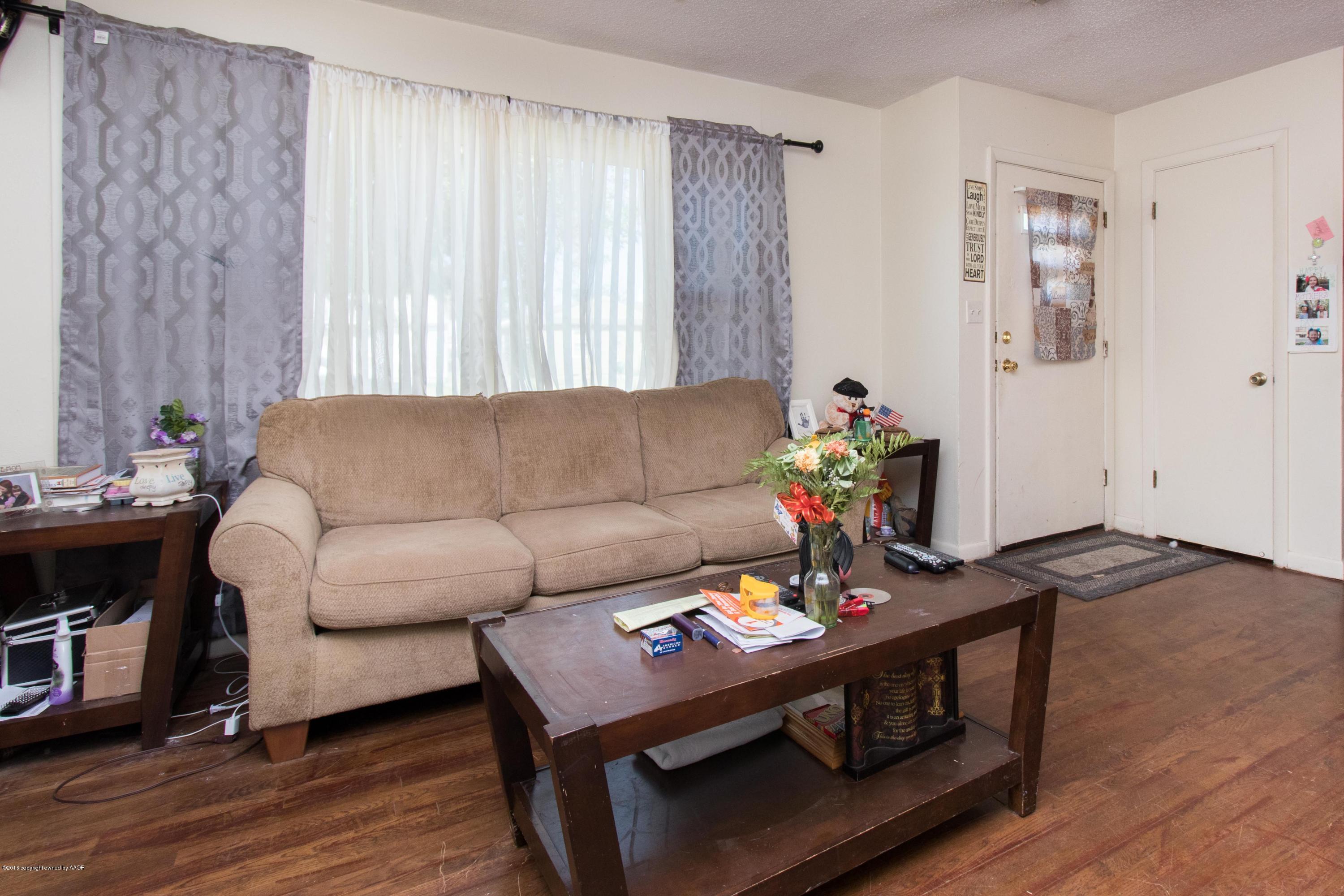 4309 South Monroe Street Amarillo, TX 79110 - Photo 6 of 16 a living room with furniture and wooden floor