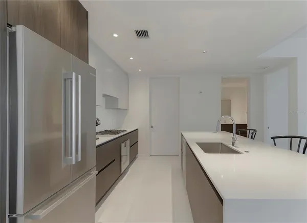 a kitchen that has a sink and a stove