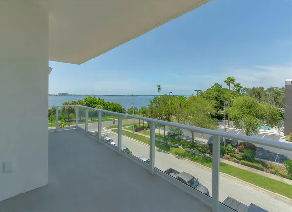 a view of a balcony with wooden floor