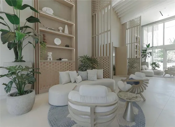 a living room with furniture and a potted plant