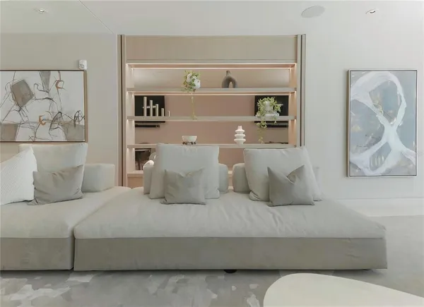 a view of a dining room with furniture and a large window