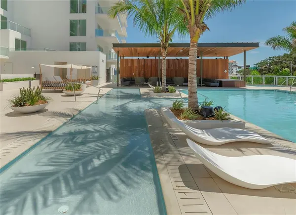 a view of a backyard with palm trees