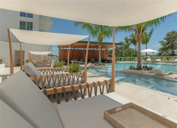 a roof deck with a bench and potted plants