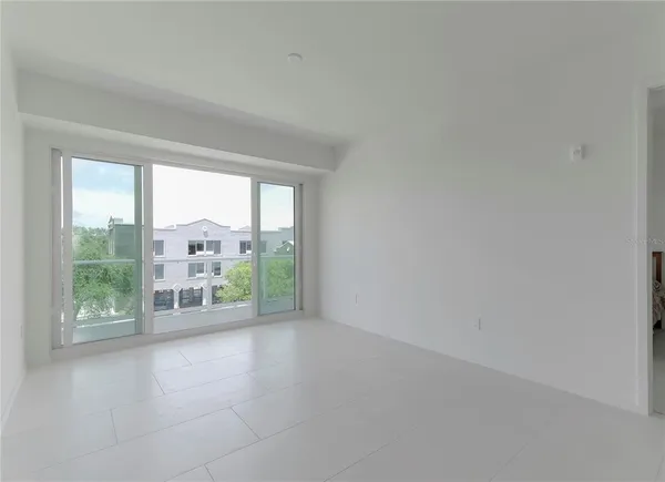wooden floor in an empty room with a glass door