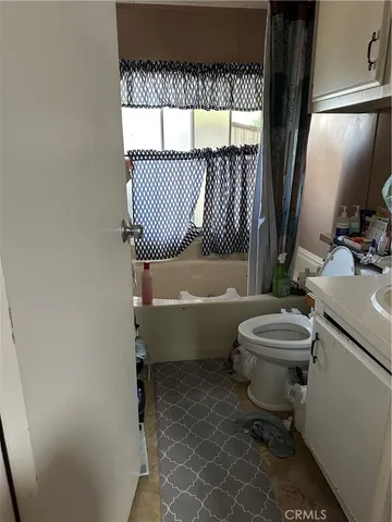 a bathroom with a toilet a sink and a bathtub