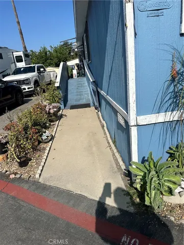 a view of a backyard with sitting area
