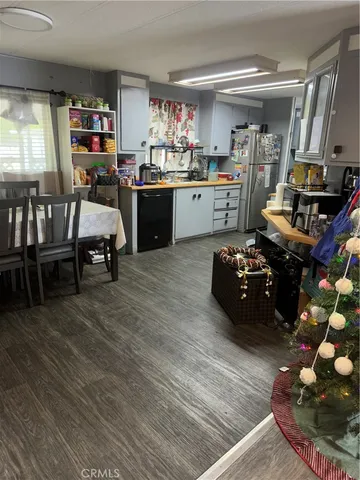 a kitchen with wooden cabinets and a stove