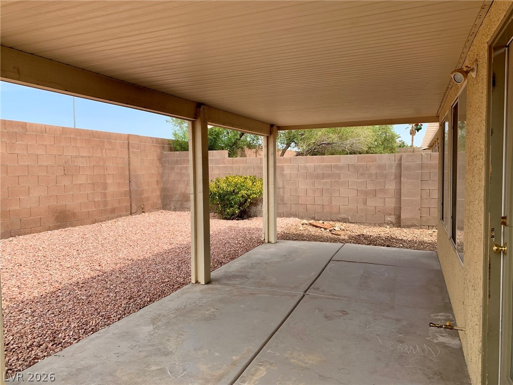3821 Bombastic Court Las Vegas, NV 89147 - Photo 34 of 36 This private outdoor space offers a covered patio and low-maintenance landscaping for comfortable enjoyment.