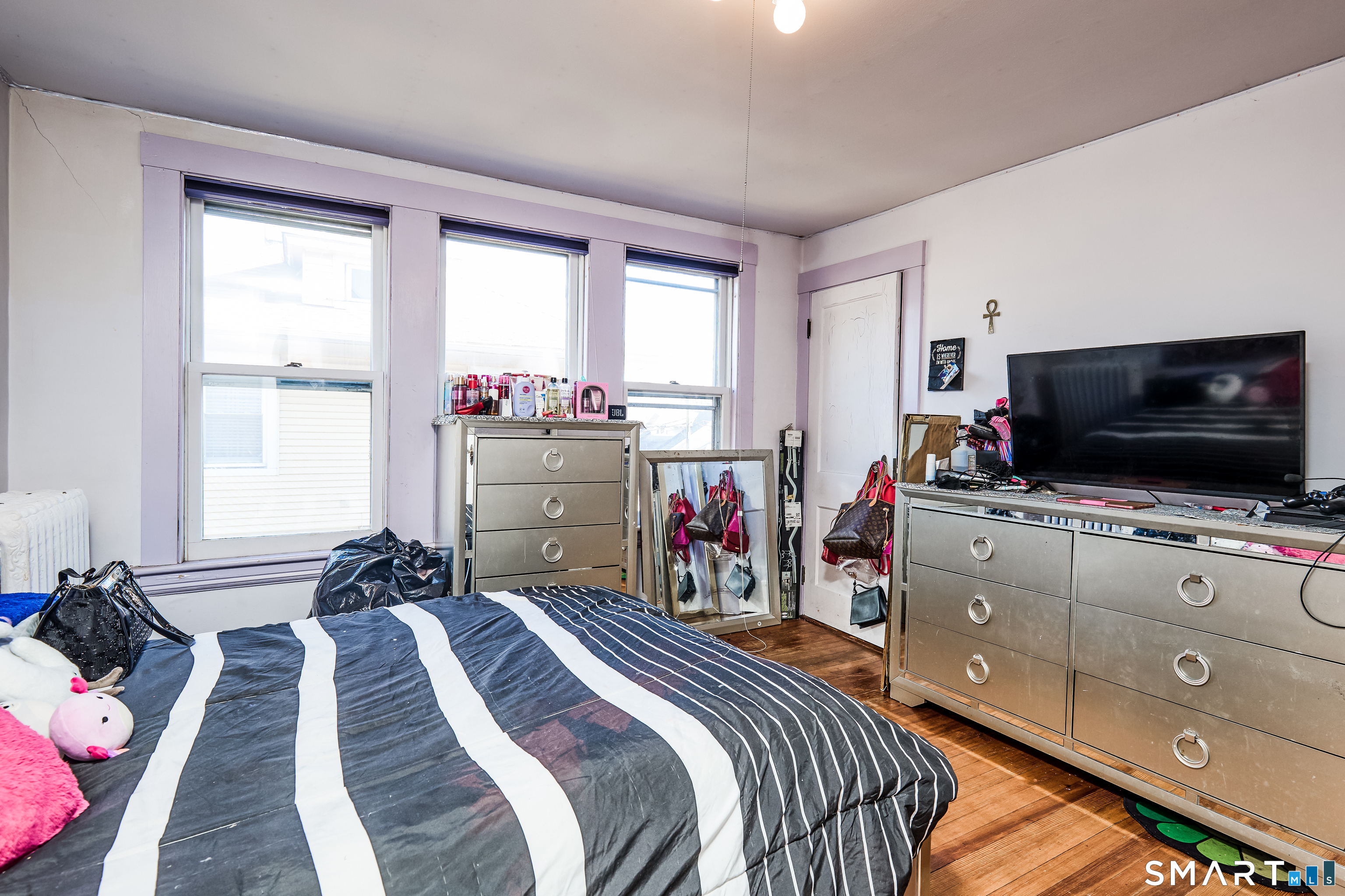 74 Harlem Avenue Bridgeport, CT 06606 - Photo 17 of 40 a bedroom with bed and flat screen tv