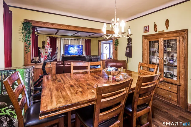 a dinning table and chairs in a room