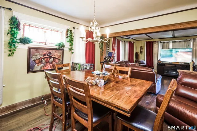 a view of a dining room with furniture window and wooden floor