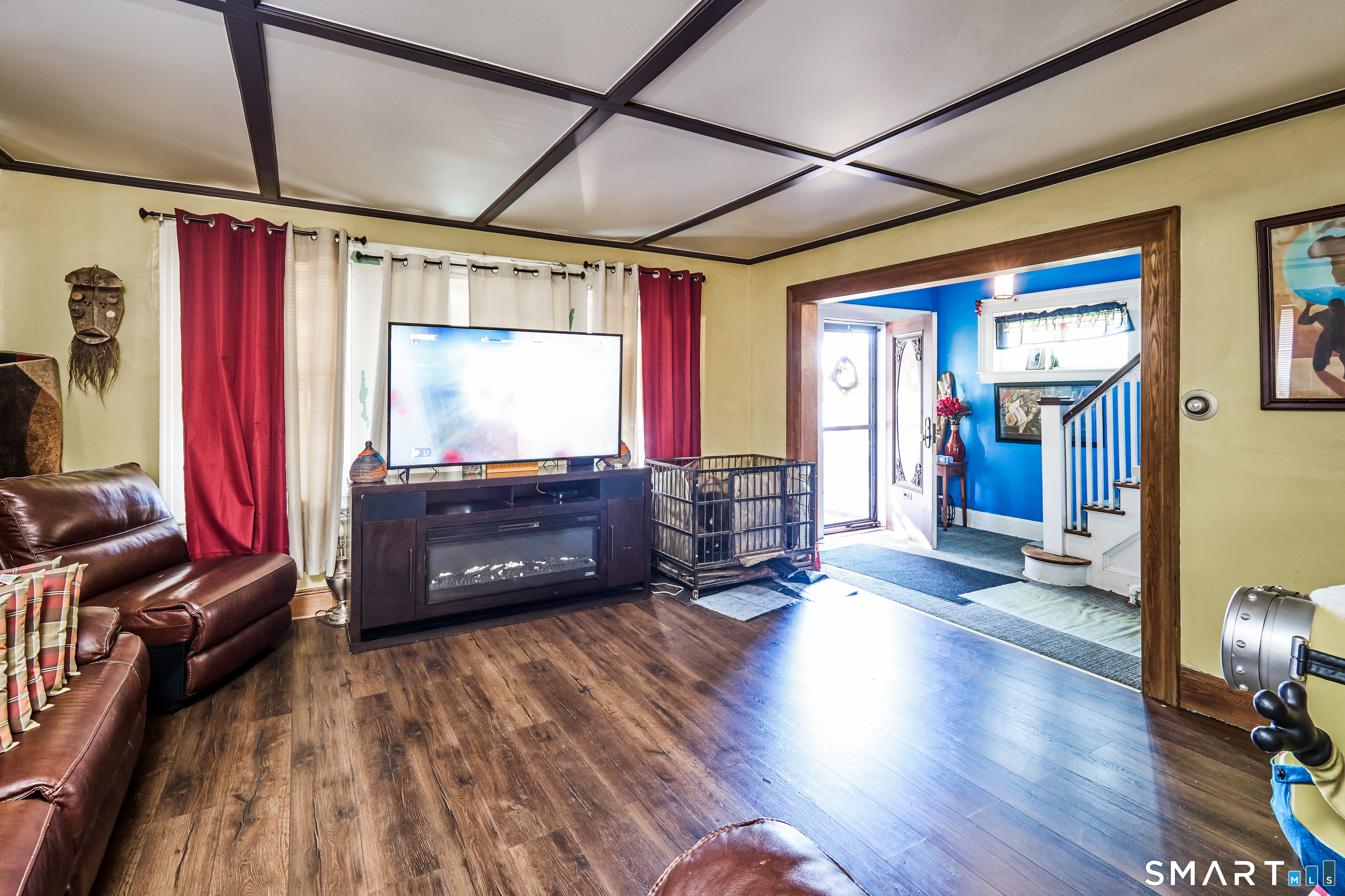 74 Harlem Avenue Bridgeport, CT 06606 - Photo 9 of 40 a room with wooden floors and furniture