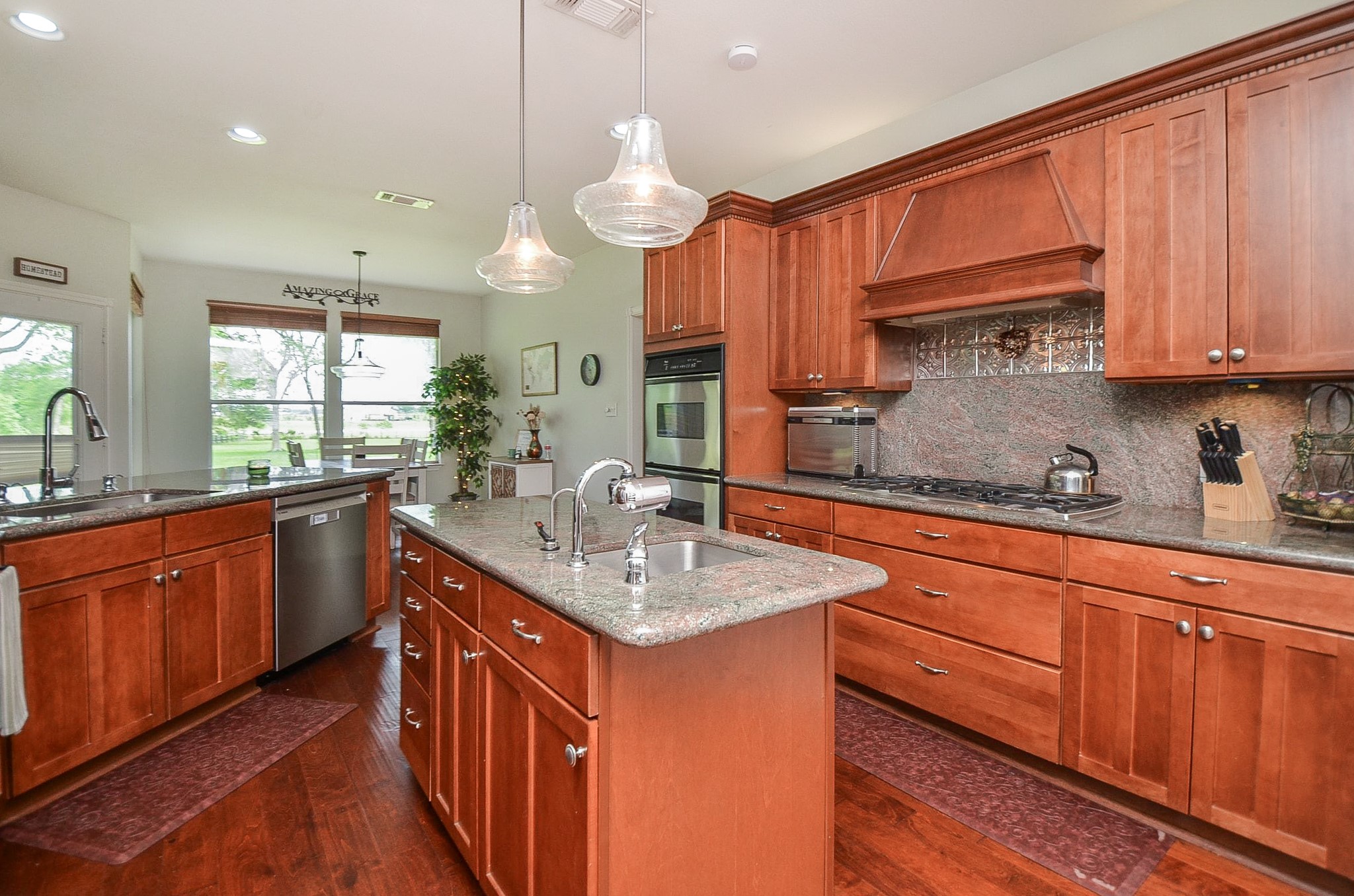 27644 Spring Hill Road Hempstead, TX 77445 - Photo 12 of 50 This spectacular chef's kitchen is a dream come true for the family cook! Gorgeous, warm, cedar colored cabinetry fills the space, up and down, with wide paths to allow easy tasking.