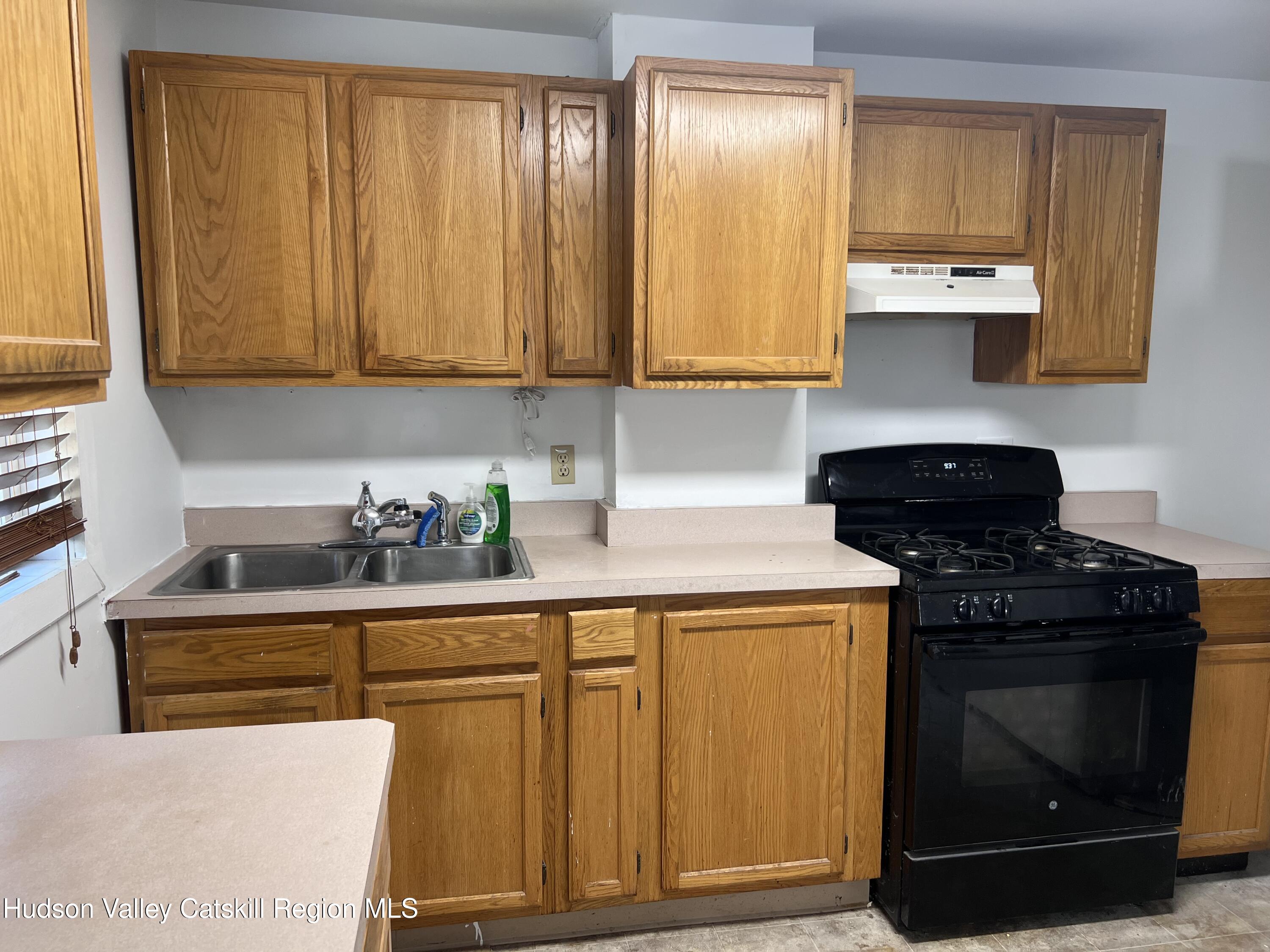 7 Berry Street Wallkill, NY 12589 - Photo 2 of 7 a kitchen with stainless steel appliances granite countertop a stove a sink and a microwave
