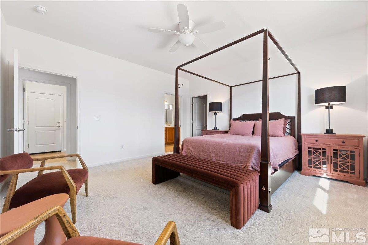 9700 Declan Drive Reno, NV 89521 - Photo 18 of 34 a bedroom with a bed and a chair