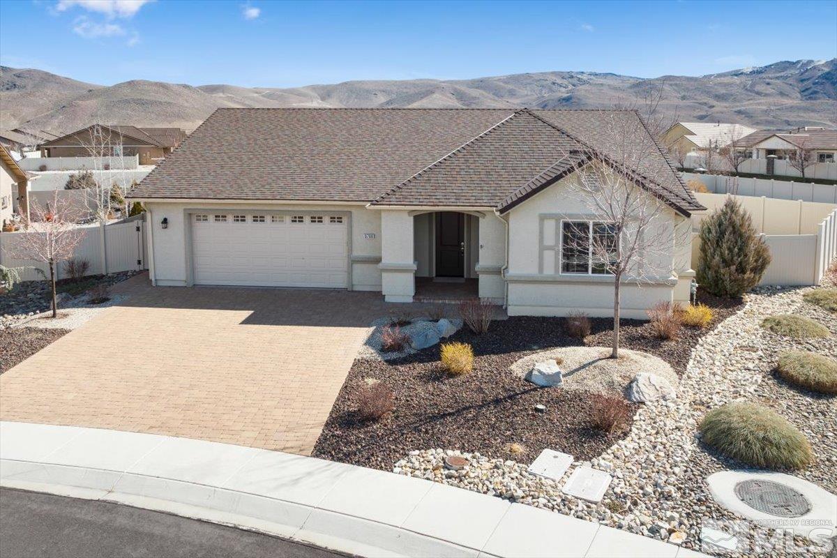 9700 Declan Drive Reno, NV 89521 - Photo 3 of 34 a front view of a house with a yard