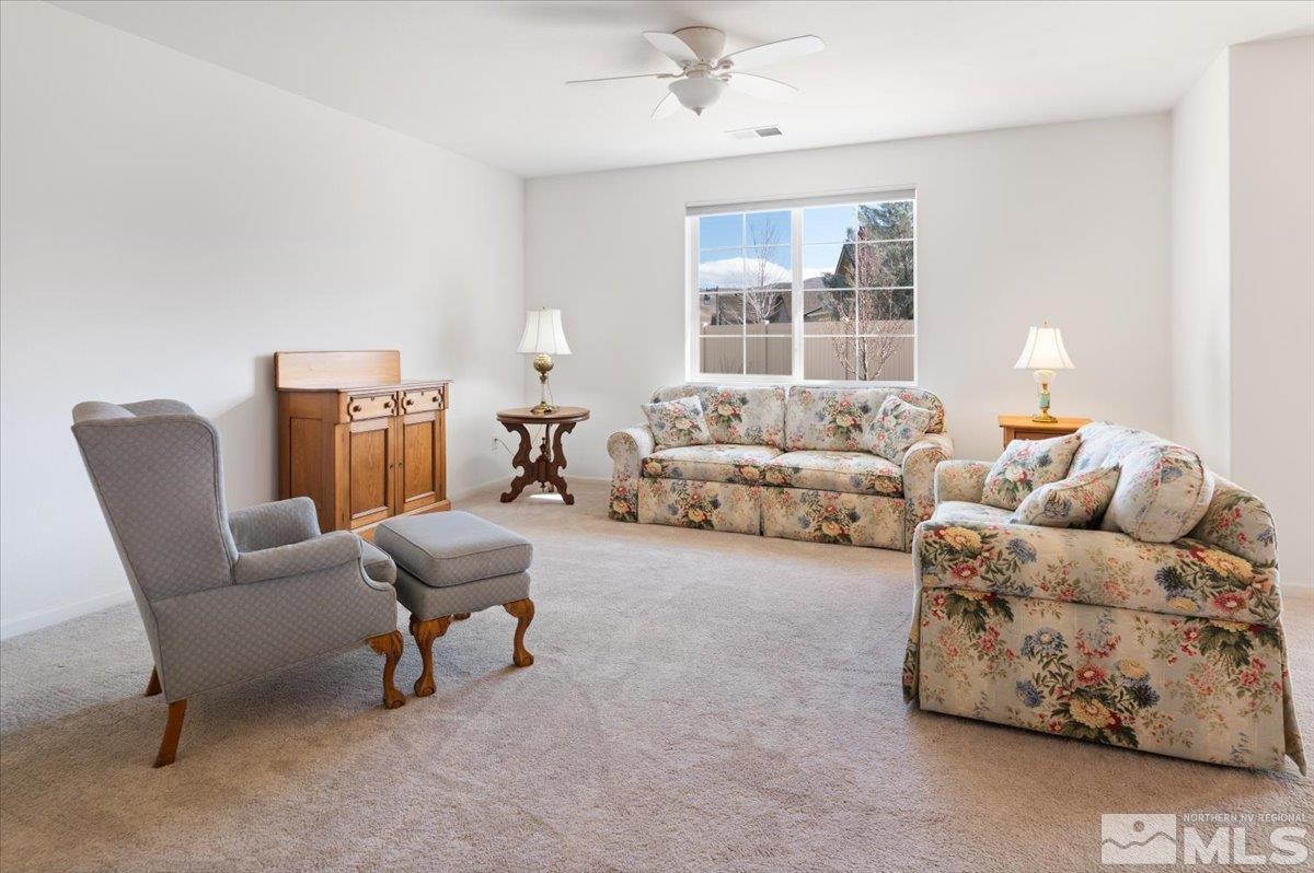 9700 Declan Drive Reno, NV 89521 - Photo 9 of 34 a living room with furniture and a large window