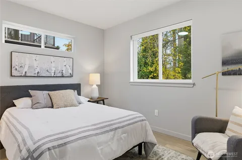 a bedroom with a bed and a couch