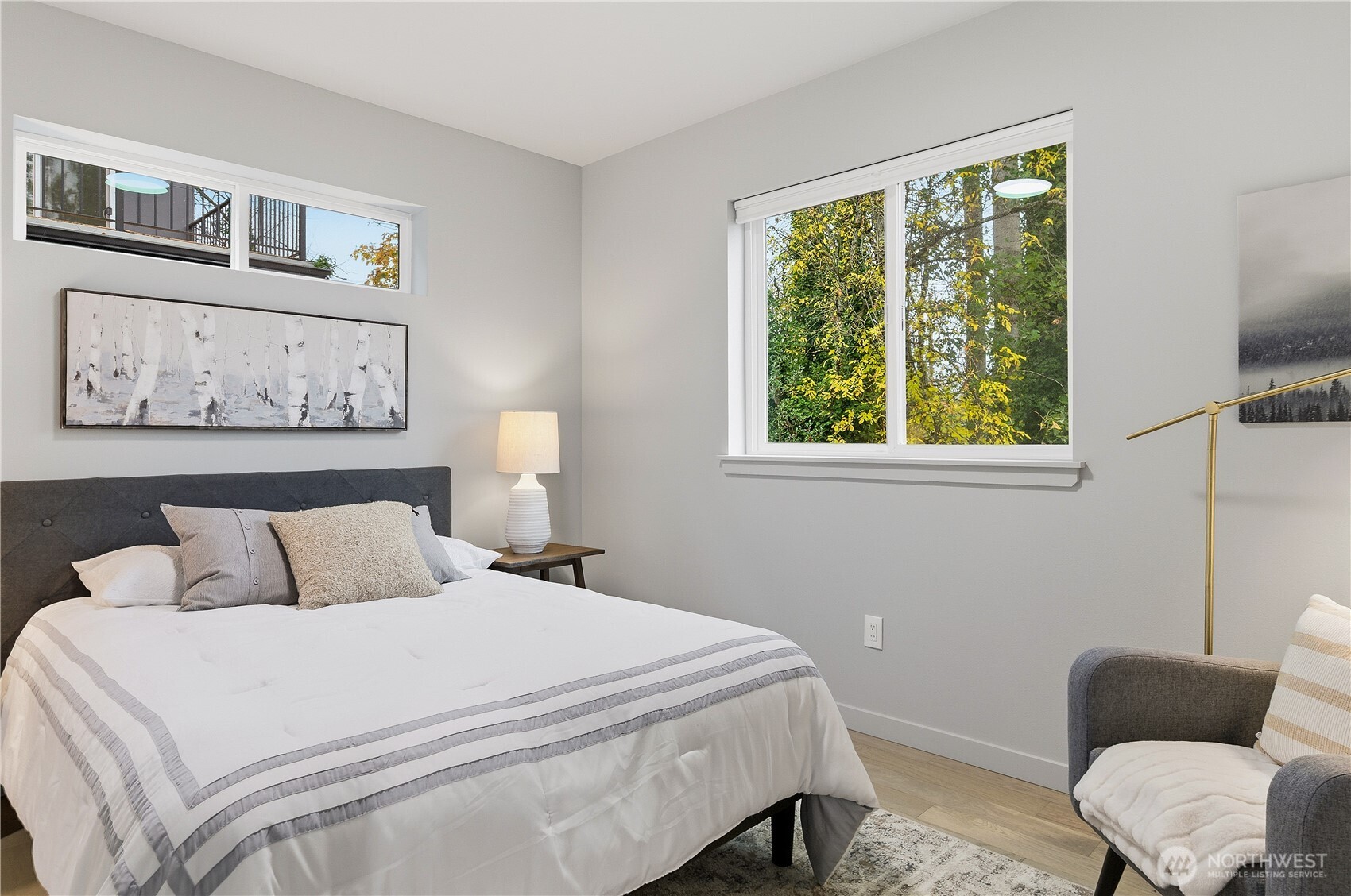 11831 59th Avenue South, Unit C Seattle, WA 98178 - Photo 17 of 26 a bedroom with a bed and a couch