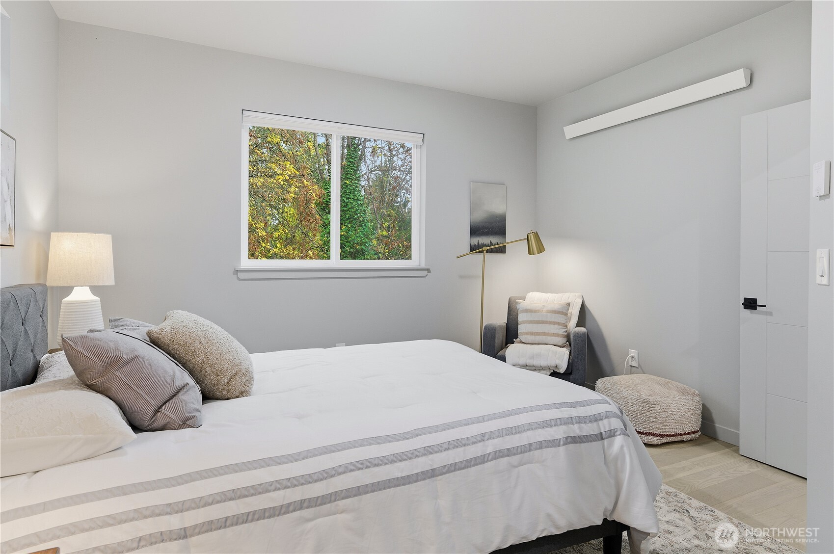 11831 59th Avenue South, Unit C Seattle, WA 98178 - Photo 19 of 26 a bedroom with a bed and a window