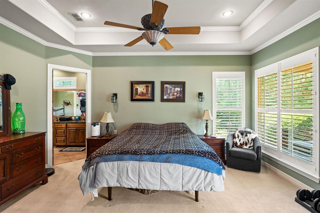 165 Whistler Lane Hallsville, TX 75650 - Photo 12 of 40 a bedroom with a large bed and a window