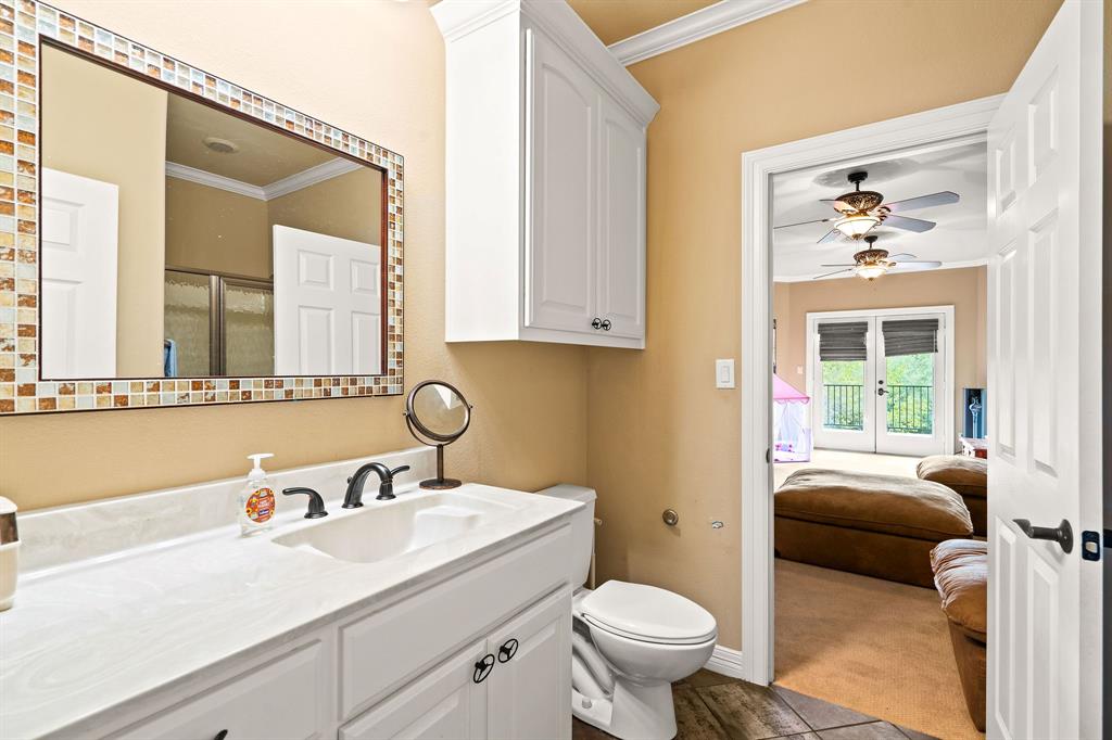 165 Whistler Lane Hallsville, TX 75650 - Photo 20 of 40 a bathroom with a sink and a mirror