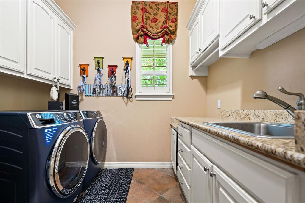 165 Whistler Lane Hallsville, TX 75650 - Photo 24 of 40 a utility room with sink dryer and washer