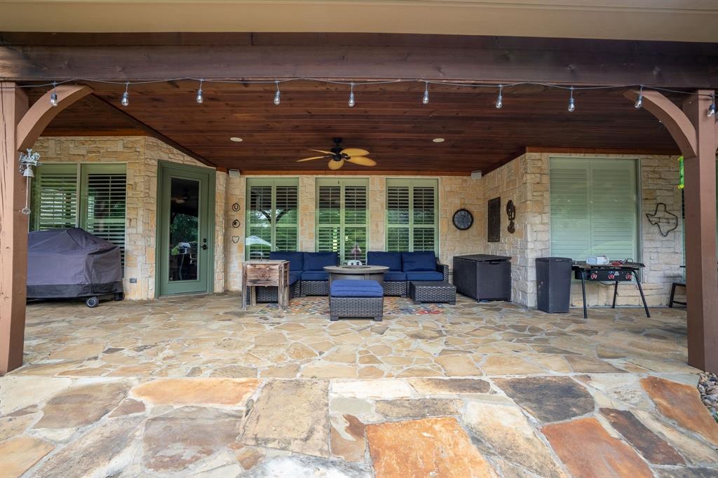 165 Whistler Lane Hallsville, TX 75650 - Photo 27 of 40 a view of a chairs and table in a patio