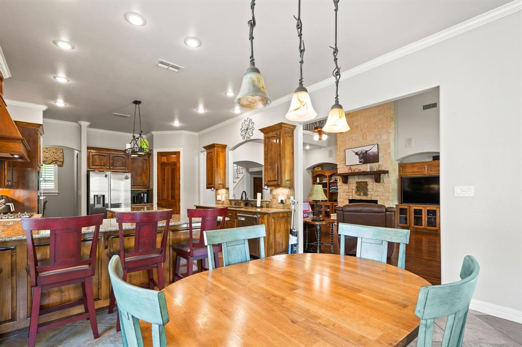 165 Whistler Lane Hallsville, TX 75650 - Photo 7 of 40 a large kitchen with a table and chairs